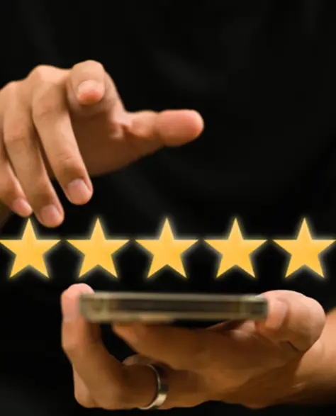 Spray Foam Insulation Contractors in Hauppauge, NY - A Man Holding a Smartphone with Five Stars Showing Above the Screen<br />
