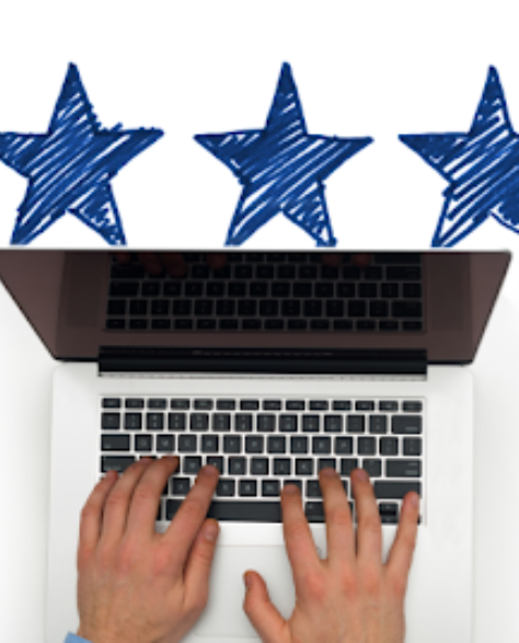 Spray Foam Insulation Contractors in Fresh Meadows, NY - A Man’s Hands Typing on a Laptop with Five Stars Scribble Above it in Navy Blue