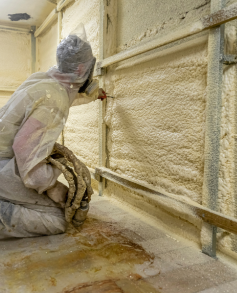 Spray Foam Insulation Contractors in Ozone Park, NY - A Spray Foam Insulation Installer Insulating a Wall