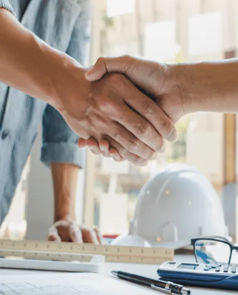 Spray Foam Insulation Contractors in Ridgewood, NY - A Construction Worker and a Homeowner Shaking Hands