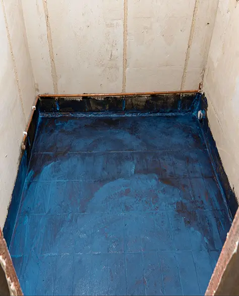 Water Damage Restoration Contractors in East Meadow, NY - A Waterproof Coating Applied on a Small Storage Room Floor