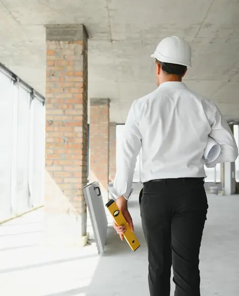 Spray Foam Insulation Contractors in Douglaston–Little Neck, NY - A Construction Foreman Walking Through a Commercial Job Site