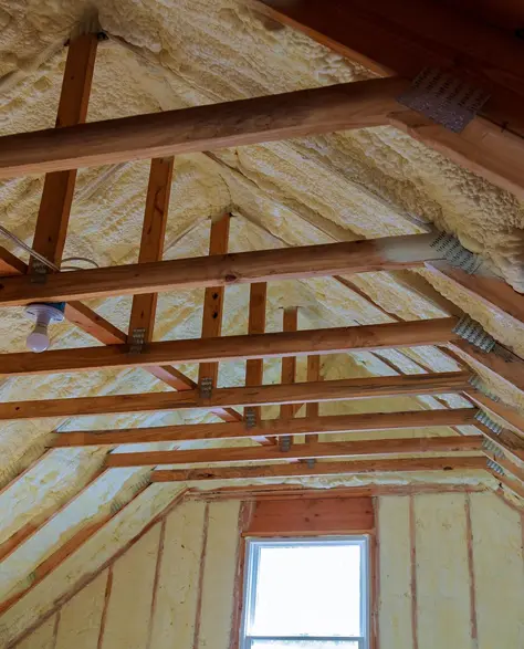 Spray Foam Insulation Contractors in Douglaston–Little Neck, NY - An Attic with Old Spray Foam In the Ceiling