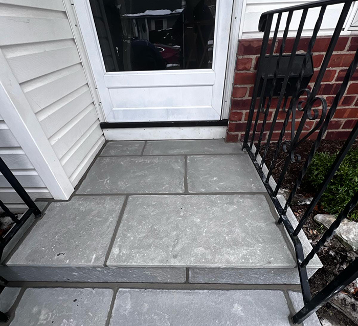 Freshly repaired step facade made up of bluestone in a property in Long Island