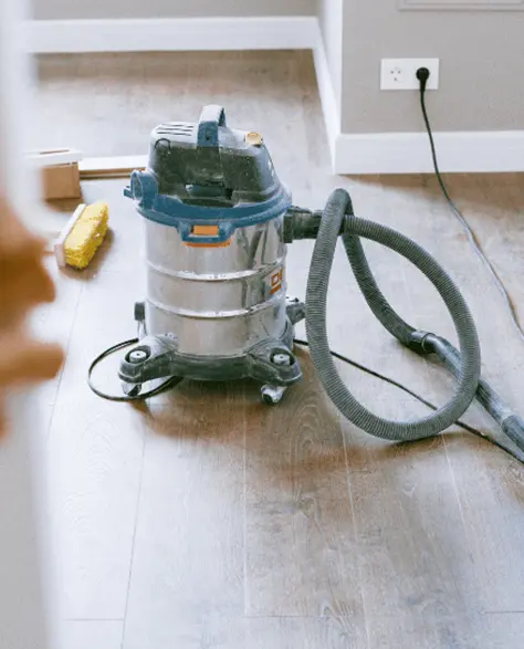 Water Damage Restoration Contractors in Hicksville, NY - Wet Dry Vac on a Floor with Attachments Laying Nearby