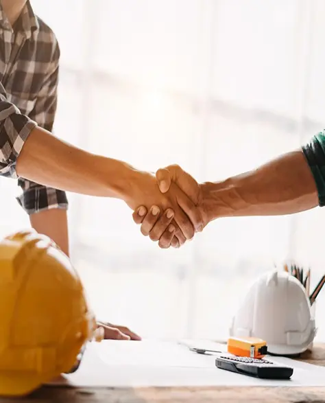 Water Damage Restoration Contractors in Levittown, NY - Two Construction People Shaking Hands