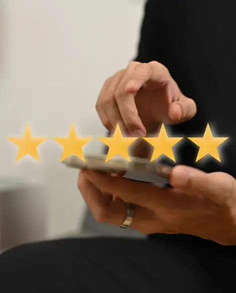 Water Damage Restoration Contractors in Long Beach, NY - A Man Holding a Smartphone Giving a Five Star Review with Five Gold Stars in the Air Above His Phone