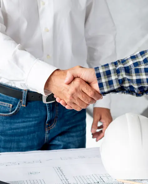 Water Damage Restoration Contractors in Long Beach, NY - Two Men Shaking Hands at a Construction Site