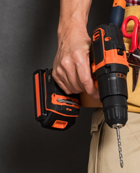 Water Damage Restoration Contractors in Midwood, NY - A Man with a Tool Pouch and Drill