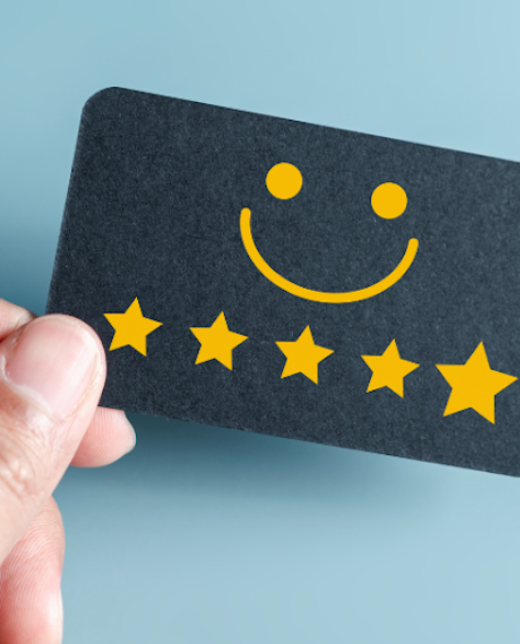 Water Damage Restoration Contractors in Bayside, NY - A hand grips a card with 5 stars and a happy face