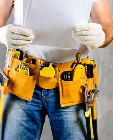 Water Damage Restoration Contractors in East Elmhurst, NY - A man wearing a tool belt<br />
