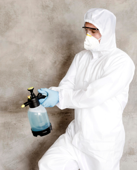 Water Damage Restoration Contractors in Gravesend, NY - A Man in a Full Protective Suit<br />
