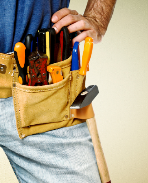 Water Damage Restoration Contractors in Homecrest, NY - A Man with a Tool Belt On and His Hand On His Hip