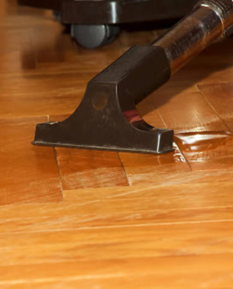 Water damage restoration contractors in Far Rockaway, NY- A dry vacuum cleaning water damage off the floor