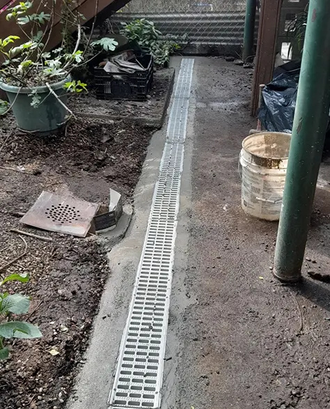 Top-Rated Foundation Repair Contractors in East Meadow, NY - A French Drain Installed by Zavza Seal to Keep Water Away from the Foundation