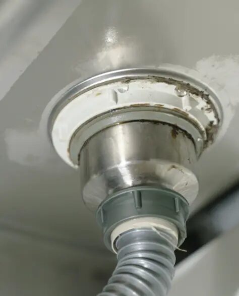 top-rated-water-damage-restoration-contractors-in-Lindenhurst-ny-1.6 Water Damage Restoration Contractors in Lindenhurst, NY - A Closeup of Leaking Sink Drain Pipe