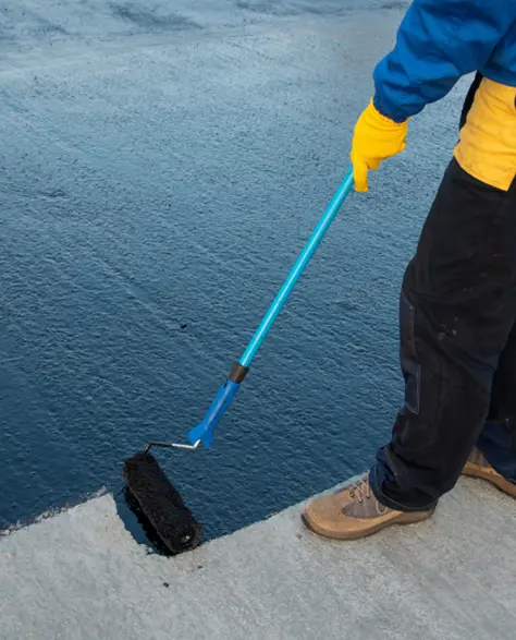 Water Damage Restoration Contractors in Deer Park, NY - Waterproofing Coating in a Bucket and a Man with a Roller