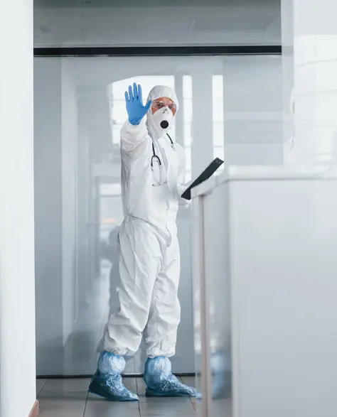 Water Damage Restoration Contractors in Gowanus, NY - A Man in a Full Body Protective Suit 