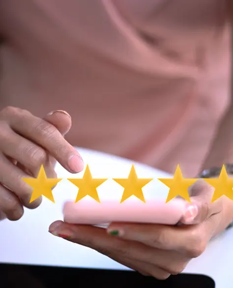 Water Damage Restoration Contractors in Hauppauge, NY - A Woman Pointing At Her Phone with Five Stars Above it