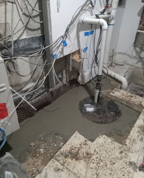 Foundation Repair Contractor in Centereach, NY - A Sump Pump Installation in the Last Stages of the Project<br />
