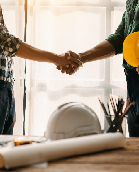 Foundation Repair Contractors in Commack, NY - Two Men Shaking Hands in an Office<br />
