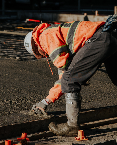 Foundation Repair Contractors in Coram, NY - A Man Working on a Cement Foundation<br />
