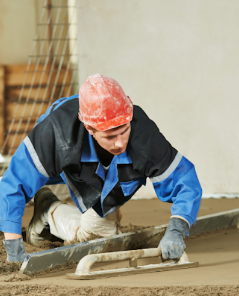 Foundation Repair Contractors in Coram, NY - A Man Floating Cement with a Trowel<br />
