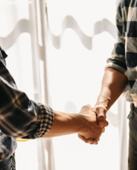 Foundation Repair Contractors in Deer Park, NY - Two Men Shaking Hands Over a Desk<br />
