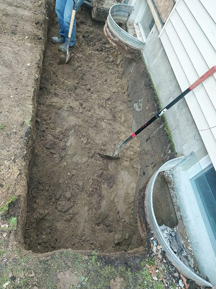 Digging to install new window wells in the basement