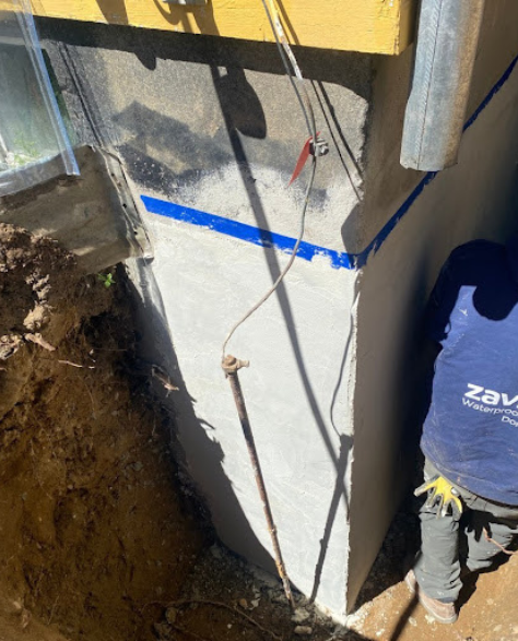 Top-Rated Foundation Repair Contractors in Long Beach, NY - A Zavza Seal Foundation Repair Specialist Working on a Foundation with Water Water Damage<br />
