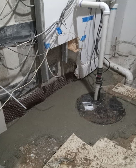 Foundation Repair Contractors in Medford, NY - A Sump Pump Installation by Zavza Seal<br />
