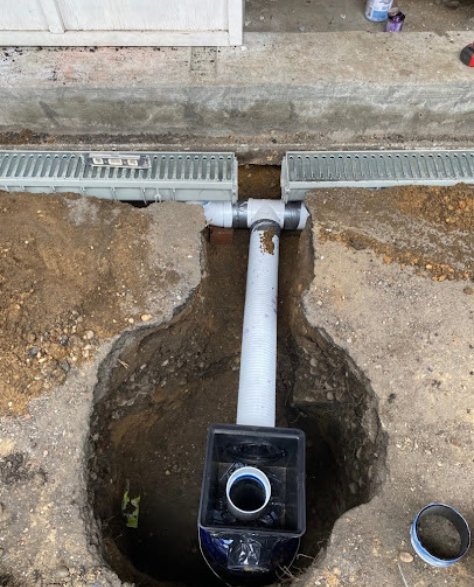 Top-Rated Foundation Repair Contractors in West Islip, NY - A Sump Pump Being Installed to Avoid Basement Flooding<br />
