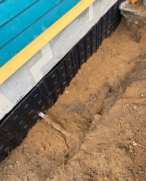 Top-Rated Foundation Repair Contractors in Smithtown, NY - A Foundation Project in Smithtown at Completion Showing a Repaired Foundation with Waterproofing<br />
