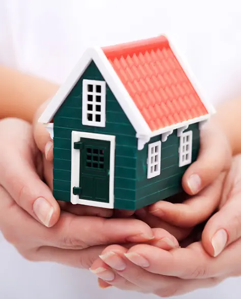 Water Damage Restoration Contractors in Long Island City, NY - A woman's hands cupping a child's hands and a home