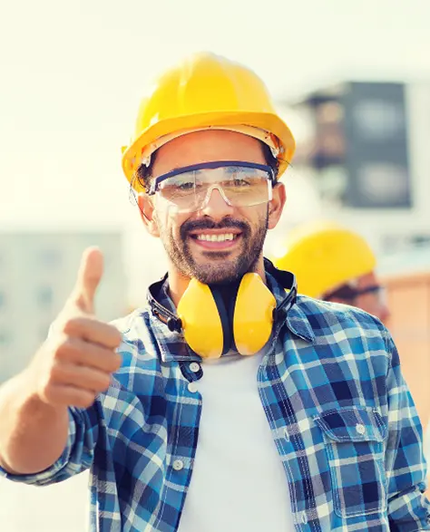 Water Damage Restoration Contractors in Long Island City, NY - Workers in yellow hard hats and one smiling and giving a thumbs up