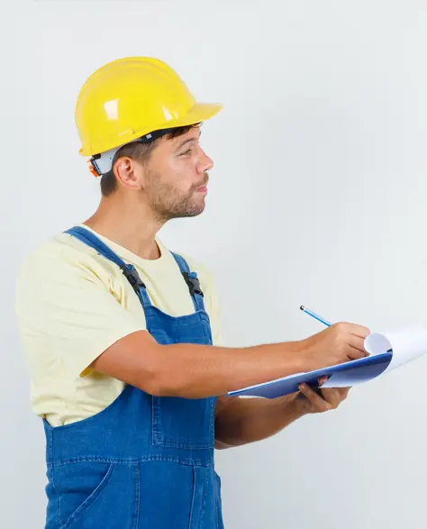 Water Damage Restoration Contractors in Richmond Hill, NY - A Man Inspecting a Home for Water Damage Holding a Clipboard<br />
