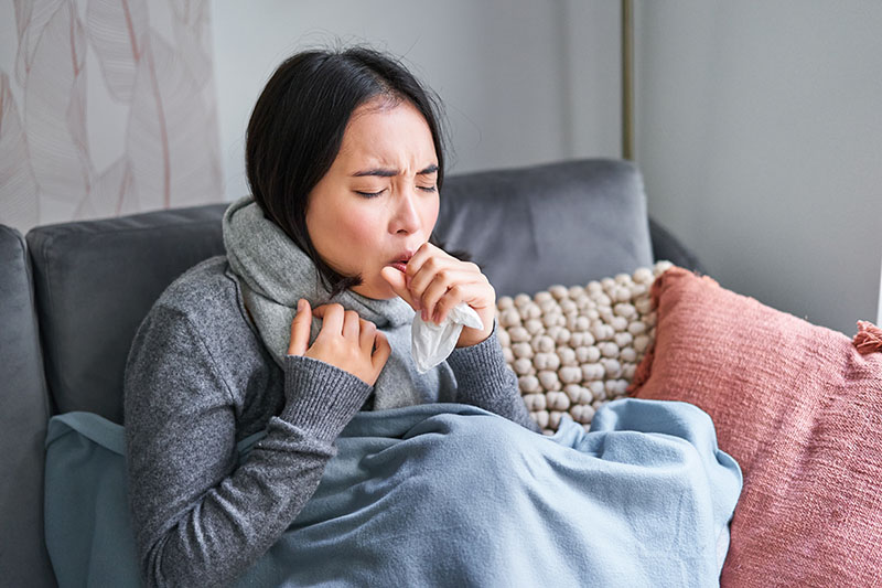 A woman coughing