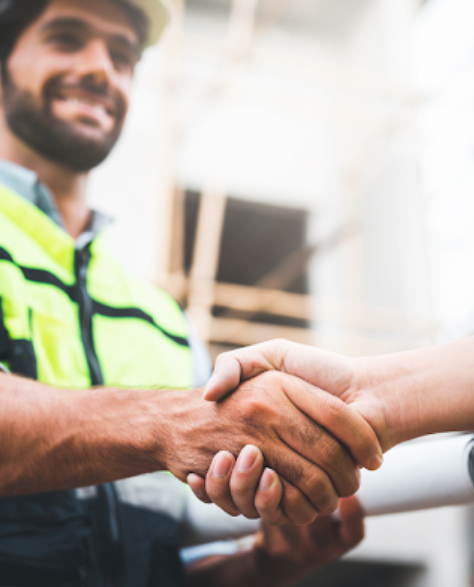 Foundation Repair Contractors in Long Island City, NY - Two Construction Workers Shaking Hands<br />
