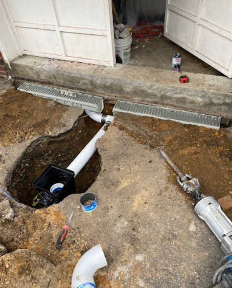 Top-Rated Foundation Repair Contractors in Richmond Hill, NY - A French Drain Installation Near Completion with a Few Tools Around it