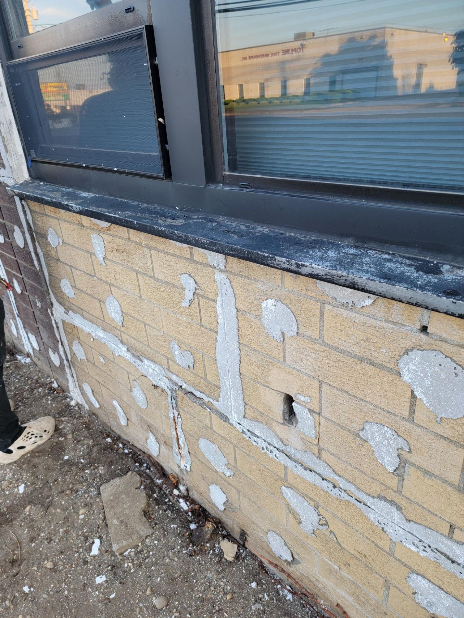 Masonry work in progress on the exterior of the facade 