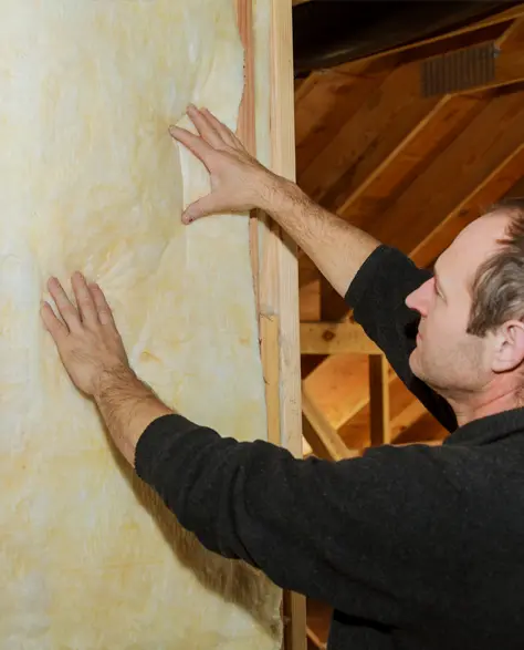 Basement Insulation Contractor in New York - An Insulation Expert Double Checking Basement Wall Insulation