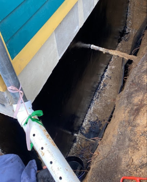 Top-Rated Foundation Repair Contractors in Bensonhurst, NY - A Zavza Seal Foundation Repair Specialist Working On a Foundation Repair Project<br />
