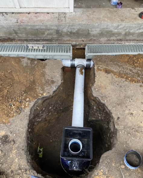 Top-Rated Foundation Repair Contractors in Bensonhurst, NY - A Sump Pump Installation About Halfway Finished<br />
