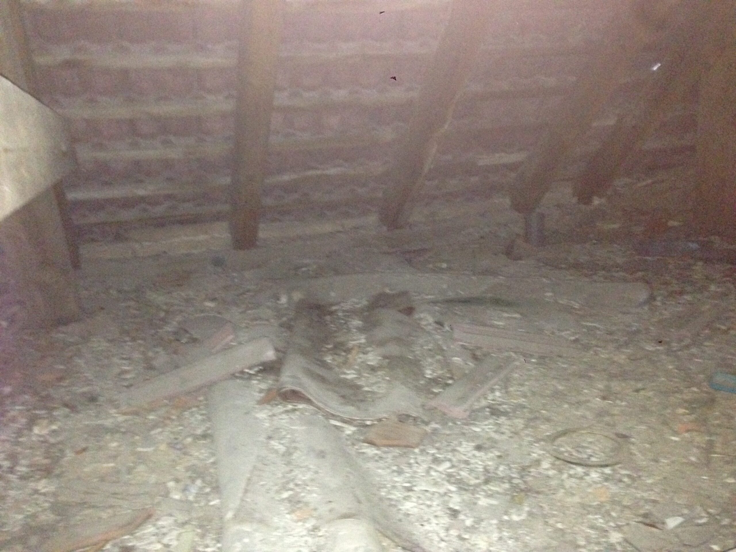 A dirty crawl space with cold drafts