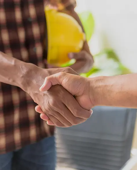 Efflorescence Removal Contractors in New York - A Contractor and a Homeowner Shaking Hands Before a Project<br />
