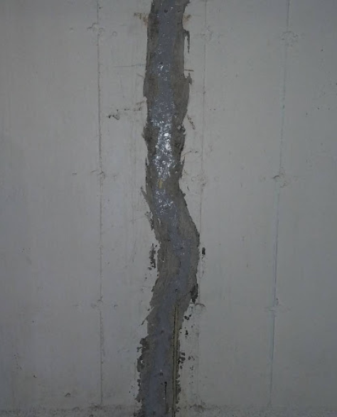 Foundation Repair Contractors in Gravesend, NY - A Picture of a Sealed Basement Wall Crack from a Foundation Repair Job<br />
