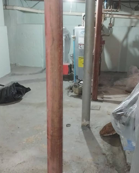  Foundation Repair Contractors in Borough Park, NY - A Foundation Support Project by  Zavza Seal Showing Lally Columns Installed in a Basement<br />
