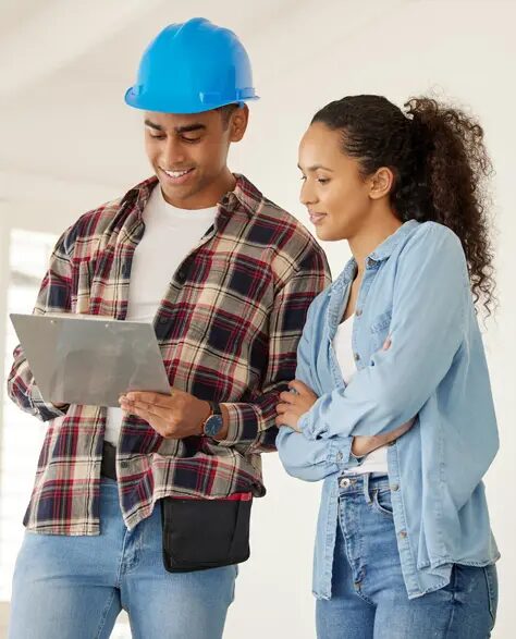 Sump Pump Installation Contractor in New York - An Inspector Holding a Clipboard Talking to a Homeowner