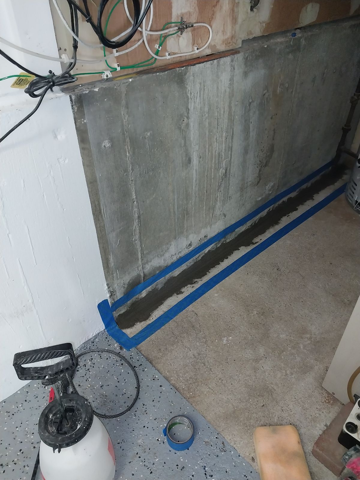 Waterproofing in progress by the Zavza Seal Team around the floor in the basement of the property in Massapequa, NY