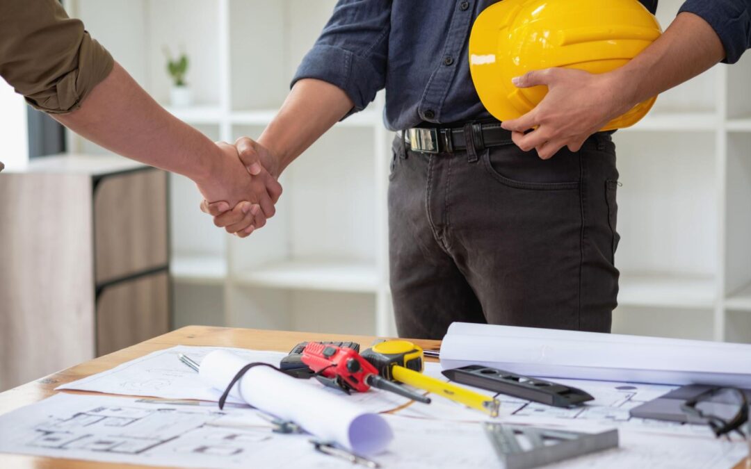 Waterproofing and Insulation Contractors in Lindenhurst, NY - A Construction Foreman Shaking Hands with a Homeowner